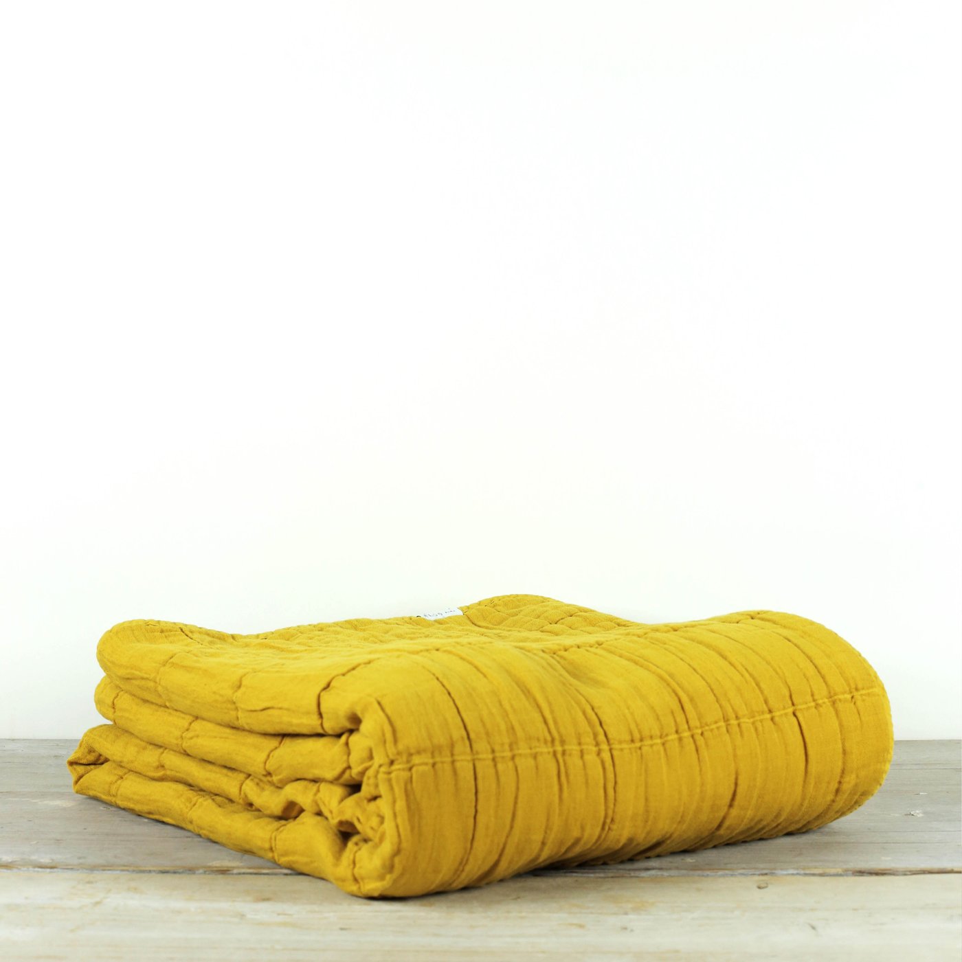 NORA GRID THROW TUMERIC